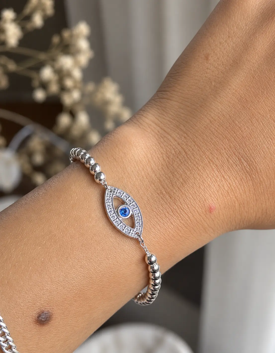 Pulsera mini esferas con dije ojo griego