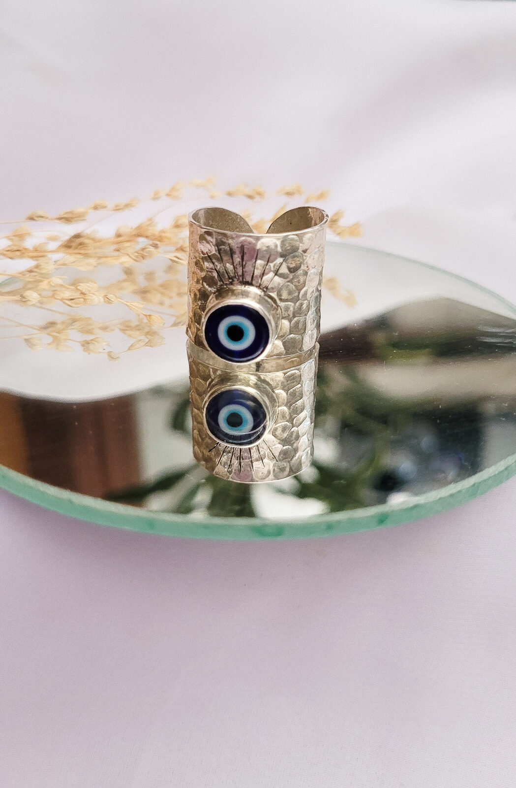 Anillo protector con pestañas regulable