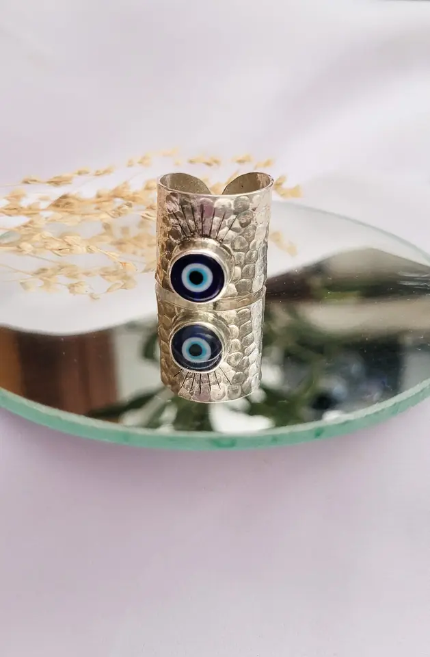 Anillo protector con pestañas regulable