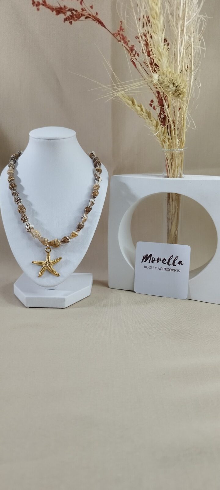 Collar caracol con dije estrella de mar