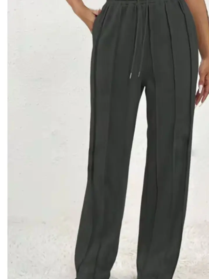 Pantalón jogger gris oscuro costuras fuera