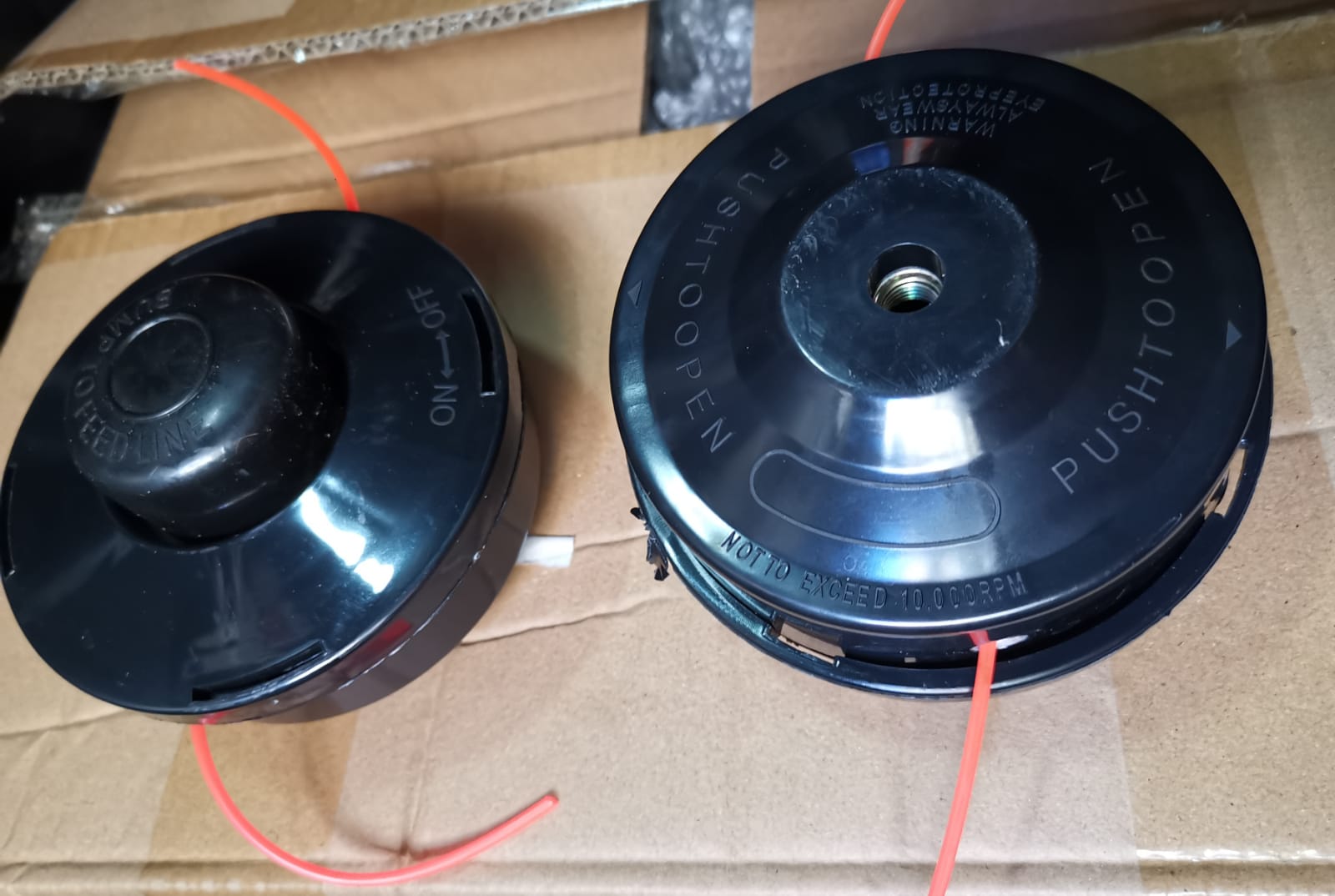 CARRETEL CABEZAL PARA DESMALEZADORA NEGRO OJAL METAL (U200) (X BULTO)
